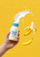 Hand Holding Yogurt Drink with Splash and Bananas