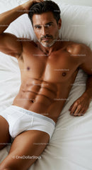 Fit mature man relaxing on bed in white underwear