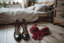 Chic Black Heels and a Red Lace Dress in a Cozy Bedroom Setting
