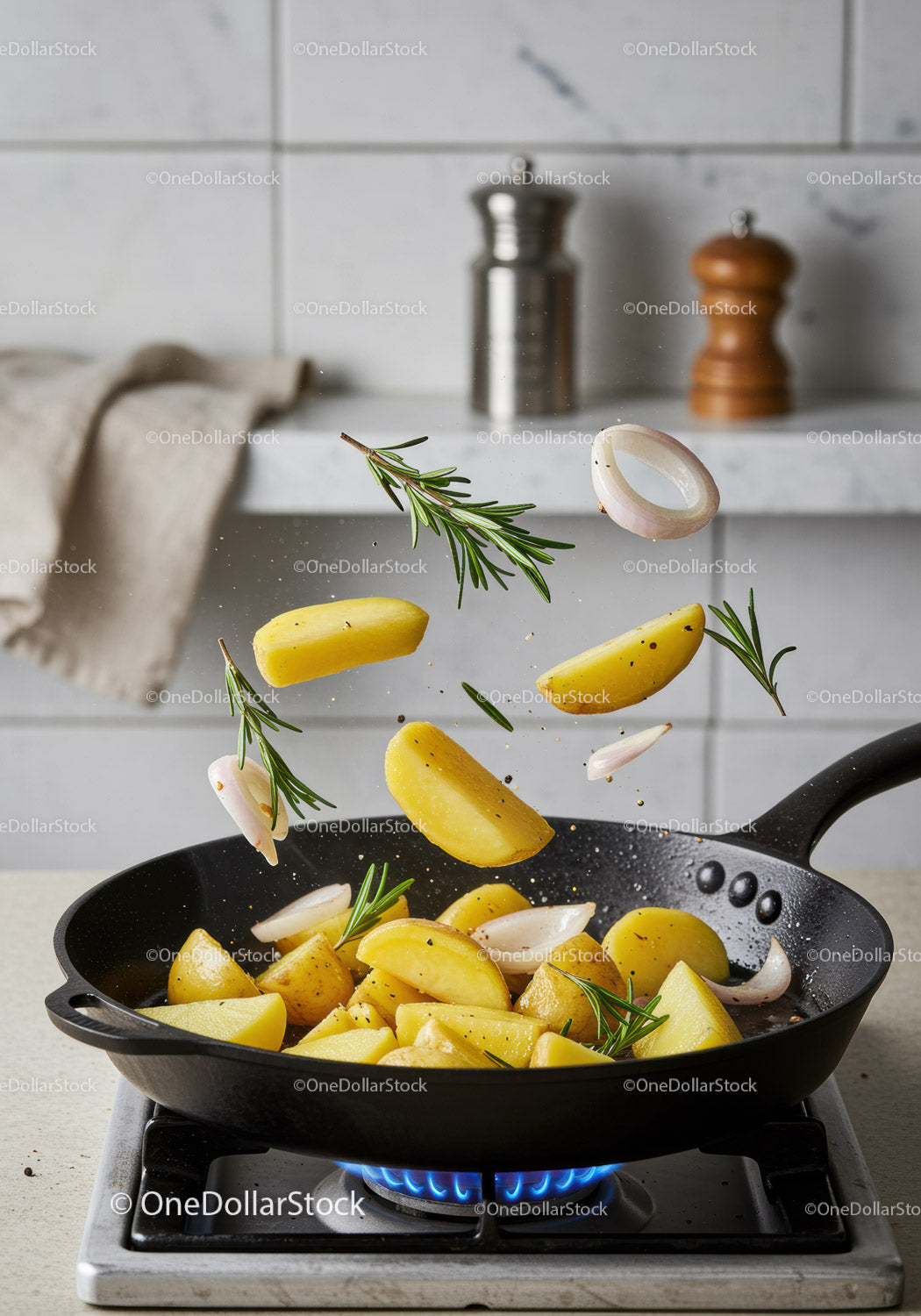 Sautéing Potatoes with Rosemary and Garlic in Pan