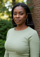 Confident woman standing outdoors with calm expression