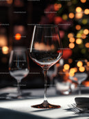 Elegant Wine Glass in Warm Restaurant Setting with Bokeh Lights