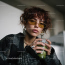 Stylish Young Woman with Curly Red Hair and Fashion Accessories