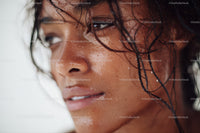 Close-up of a Woman with Wet Hair and Dewy Skin