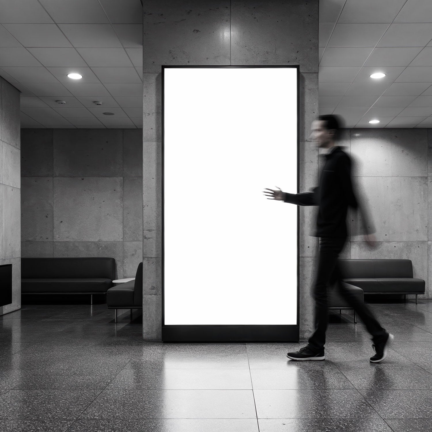 Blurred Man Walking Past Empty Lightbox in Modern Lobby