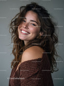 Joyful Young Woman with Curly Hair Smiling in Studio Portrait