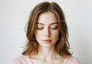 Portrait of a Young Woman with Light Brown Hair and Soft Makeup