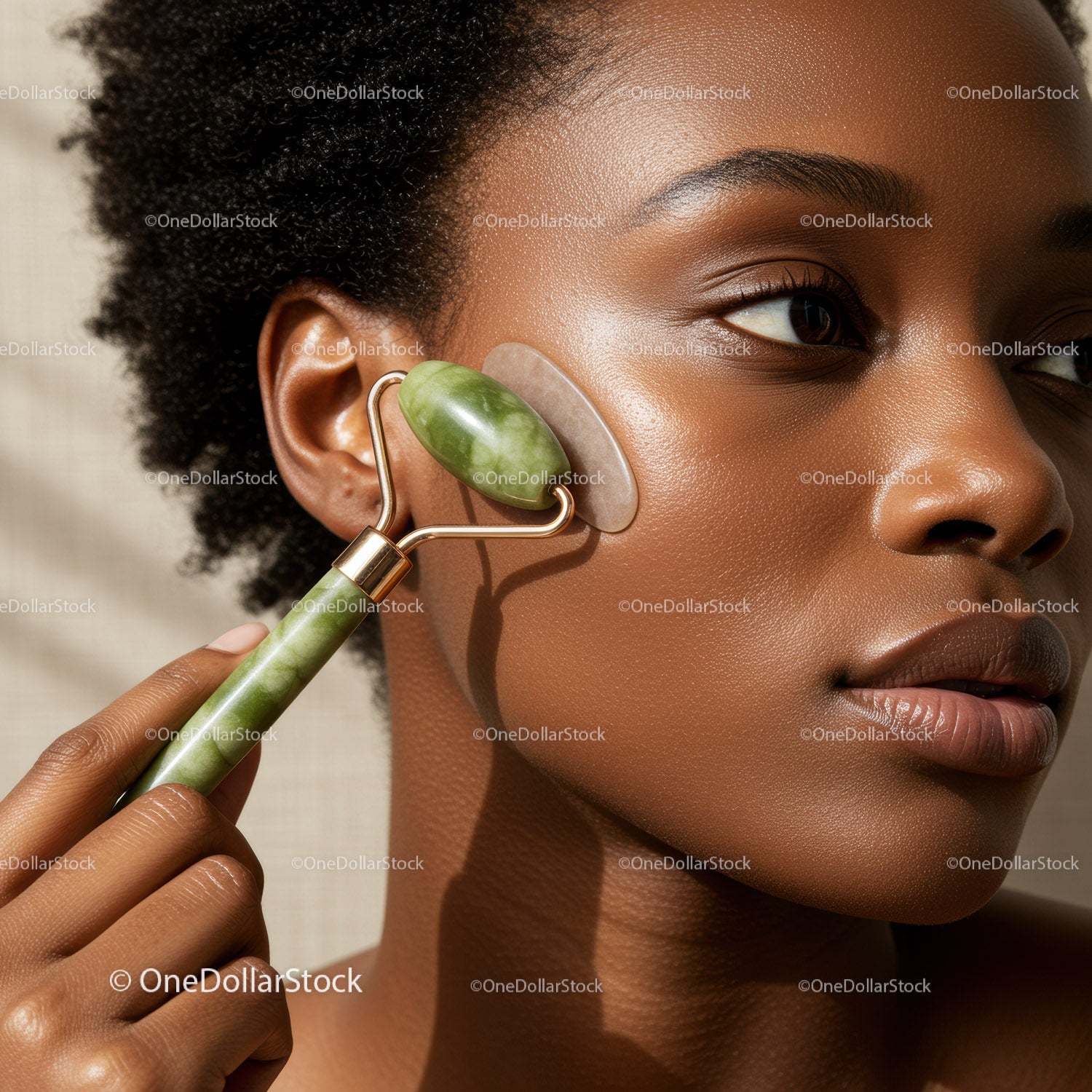 Close Up of African American Woman with Jade Facial Roller