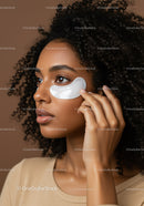 Young Woman Applying Under-Eye Patch for Skincare Rejuvenation