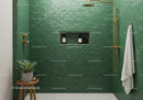 Elegant green tiled bathroom shower with gold fixtures