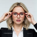 Confident Woman Adjusting Red Glasses with Blonde Hair
