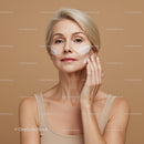Elegant Mature Woman Applying Skincare Cream in Beauty Routine
