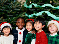 Smiling diverse children celebrating Christmas together