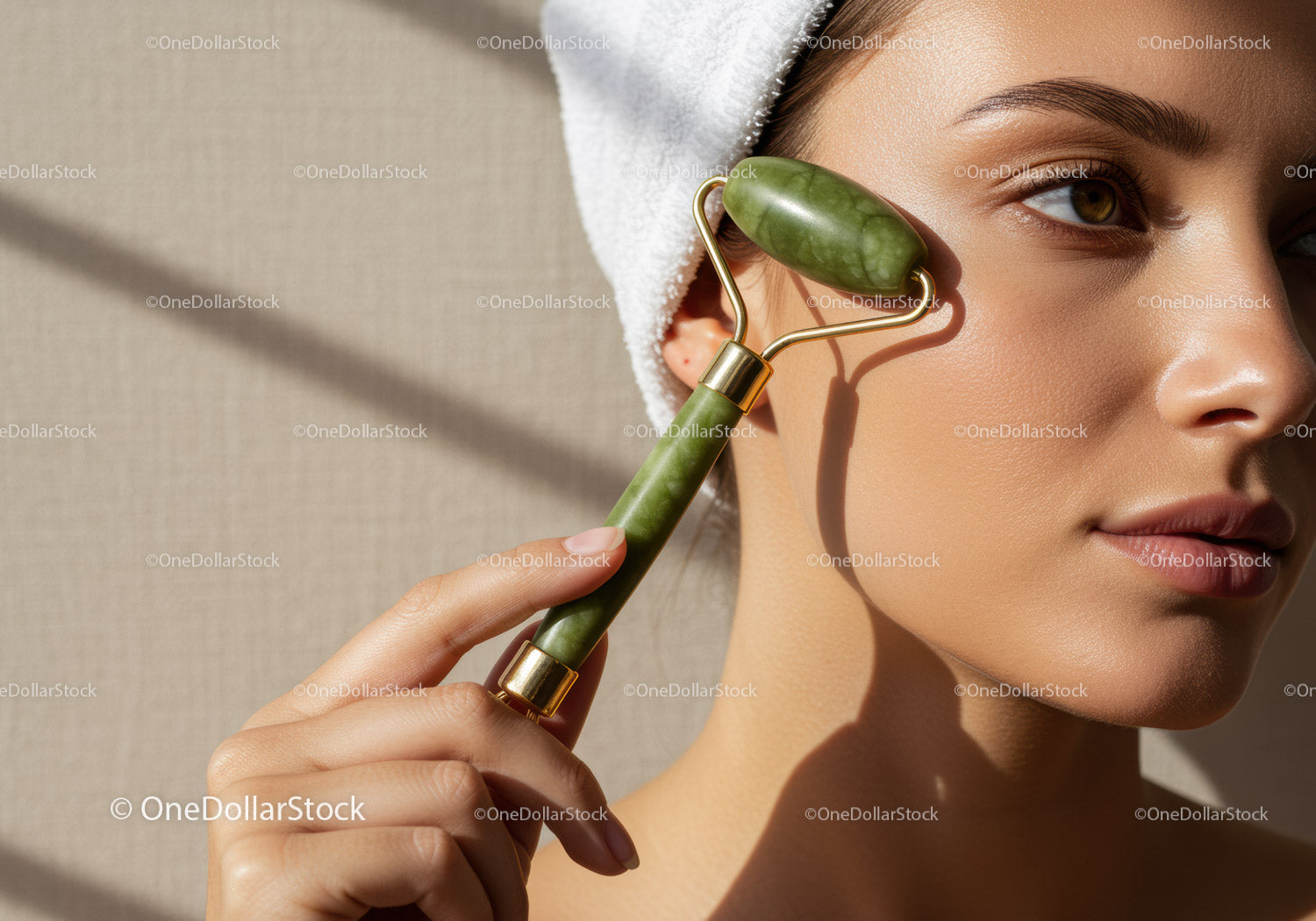 Woman Using Jade Roller for Facial Skincare and Beauty Treatment