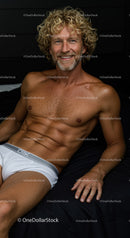 Smiling muscular man with curly hair in white underwear
