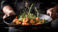 Seafood dish with shrimp and fresh herbs on black plate