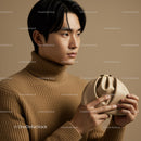 Stylish Young Man with Beige Clutch Bag in Minimalist Fashion Portrait