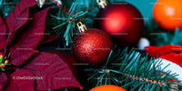 Close up of festive Christmas ornaments and poinsettia leaves