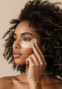 Young Woman Applying Facial Serum for Skin Care Routine