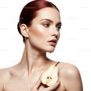 Elegant Woman Holding Fresh Pear with Flawless Skin and Soft Lighting