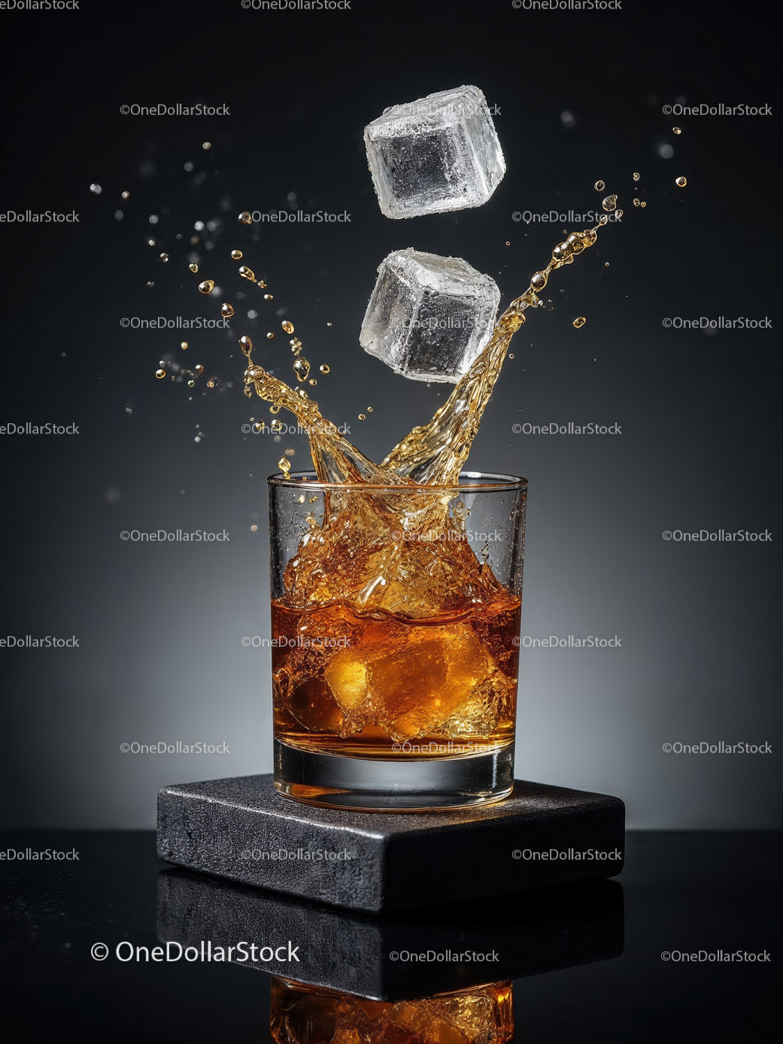Whiskey splash with ice cubes in clear glass