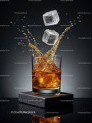 Whiskey splash with ice cubes in clear glass