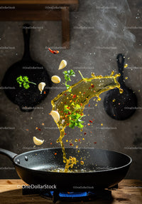 Fresh herbs and garlic sizzling in hot oil over stove