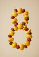 Number eight made of fresh lemons and strawberries