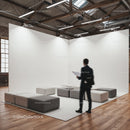 Modern workspace with minimalist seating and man walking
