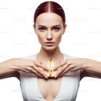 Elegant Woman with Red Hair Holding Pear in Studio Portrait
