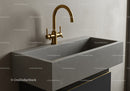 Modern Concrete Sink with Gold Faucet in Stylish Bathroom