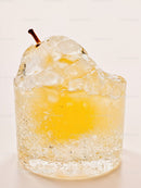 Elegant pear-shaped yellow dessert in clear jelly