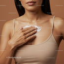 Close-up of Woman Applying Moisturizer on Neck and Chest