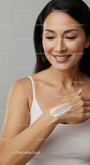 Beautiful Woman Applying Skincare Cream for Healthy Glowing Skin