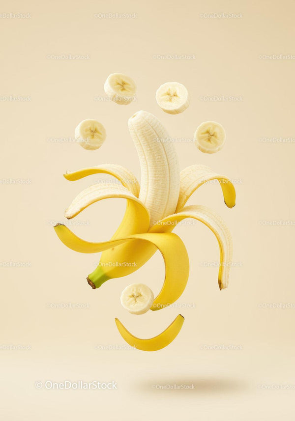 Fresh peeled banana with floating banana slices