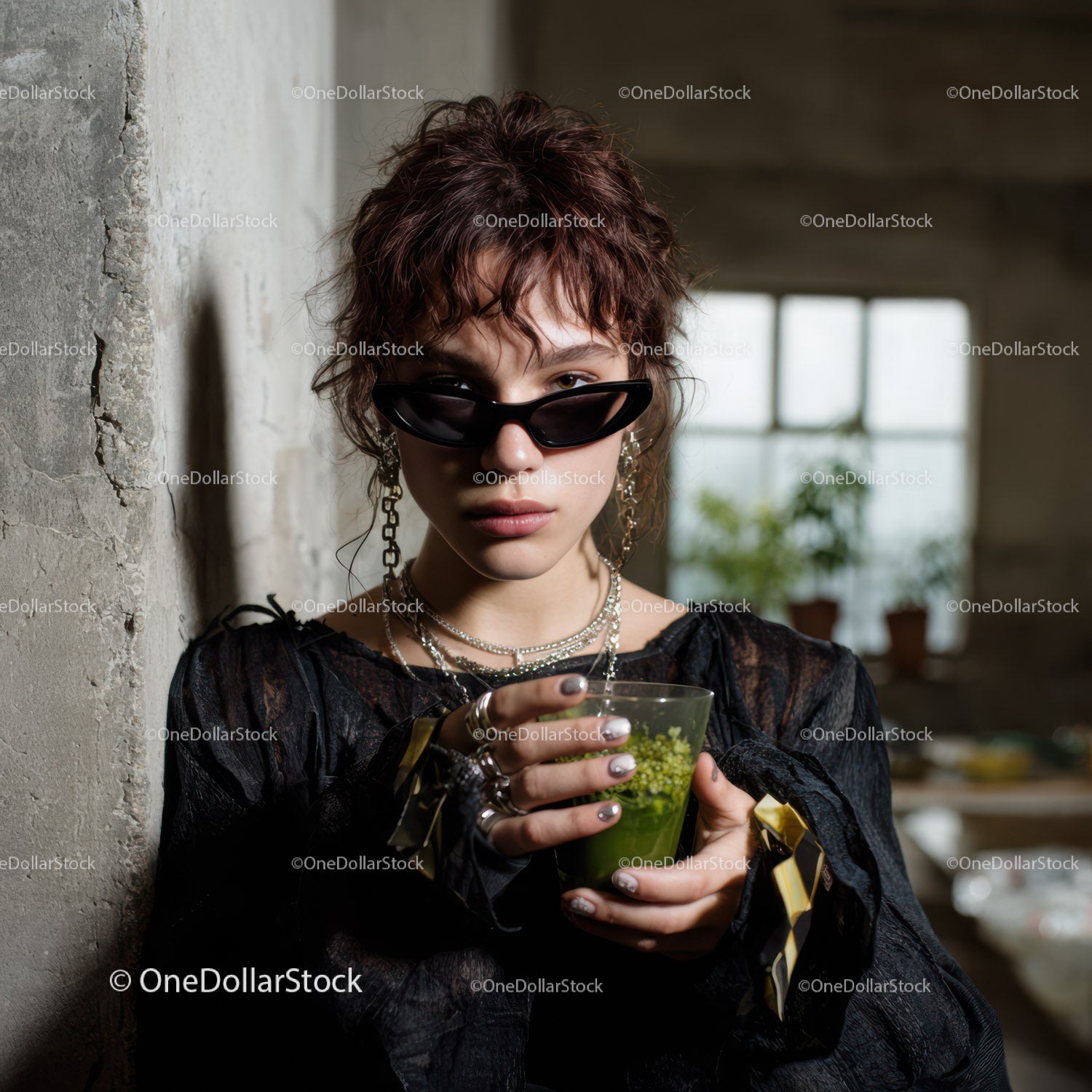 Stylish Young Woman with Sunglasses and Jewelry in Urban Setting