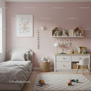 Modern Baby Nursery with Pastel Pink Wall and Wooden Decor