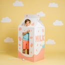 Smiling child inside playful milk carton costume