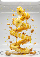 Banana slices drizzled with honey and floating peanuts