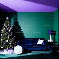 Modern living room with decorated Christmas tree and blue sofa