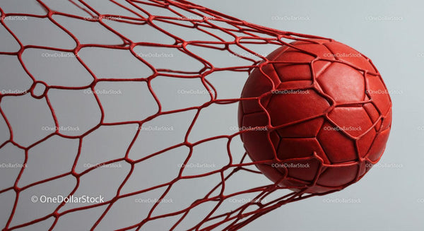 Red Soccer Ball in Goal Net for Sports and Game Concept