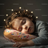 Peaceful child sleeping on colorful donut pillow