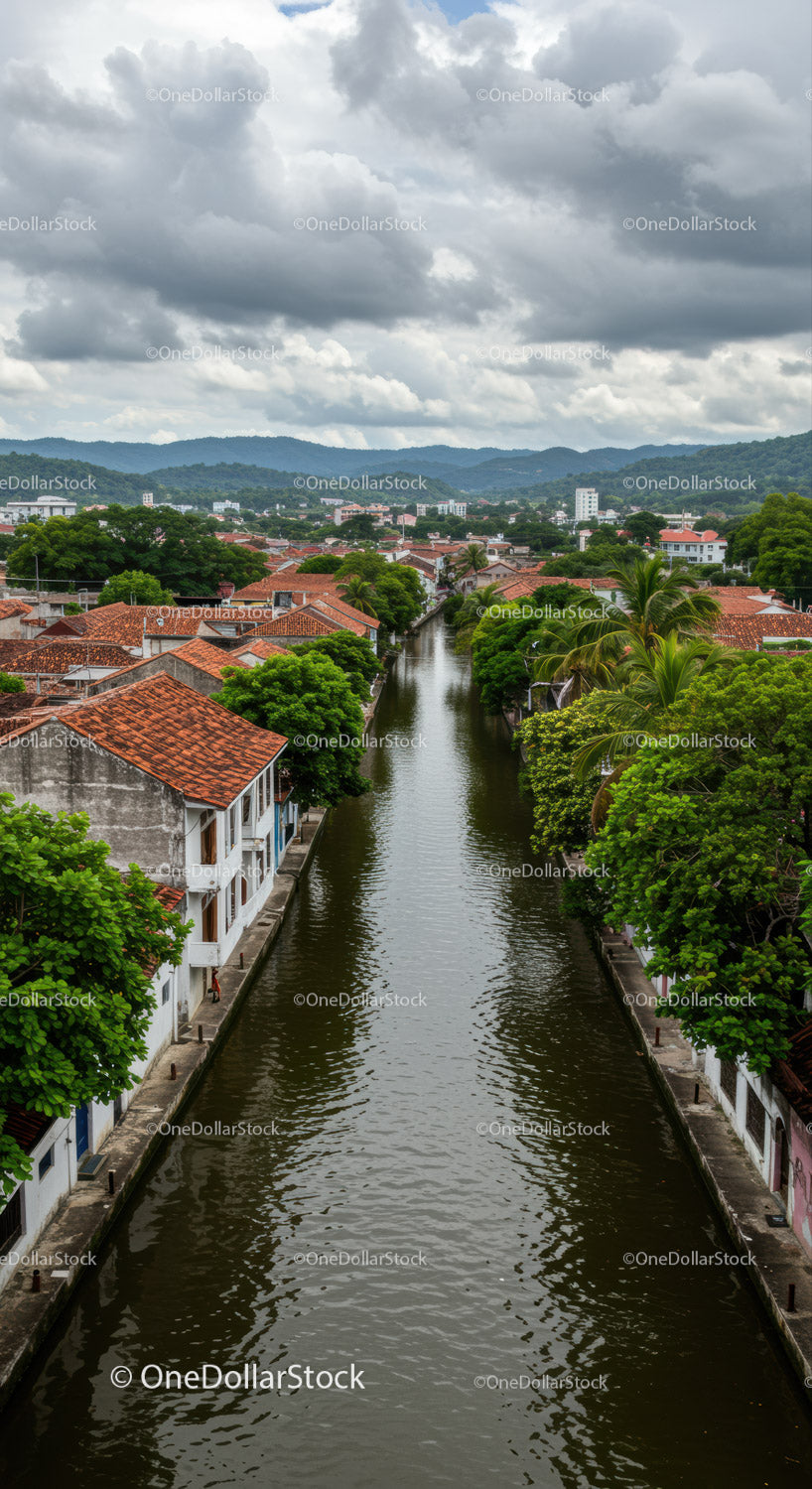 Tropical Town Amid Lush Greenery and Cloudy Sky
