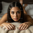 Young Woman with Dark Hair and Hair Clips Lying on Cozy Blanket