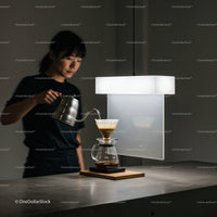 Woman Brewing Pour Over Coffee in Minimalist Kitchen
