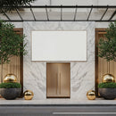 Modern marble entrance with gold accents and greenery