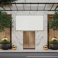 Modern marble entrance with gold accents and greenery