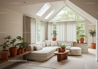 Bright living room with beige sofa and indoor plants