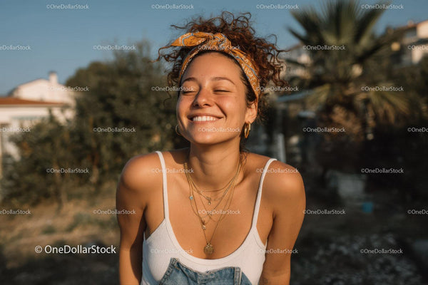 Joyful Young Woman Smiling Outdoors in Warm Sunset Light