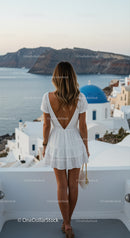 Woman in White Dress Enjoying Santorini Sea View